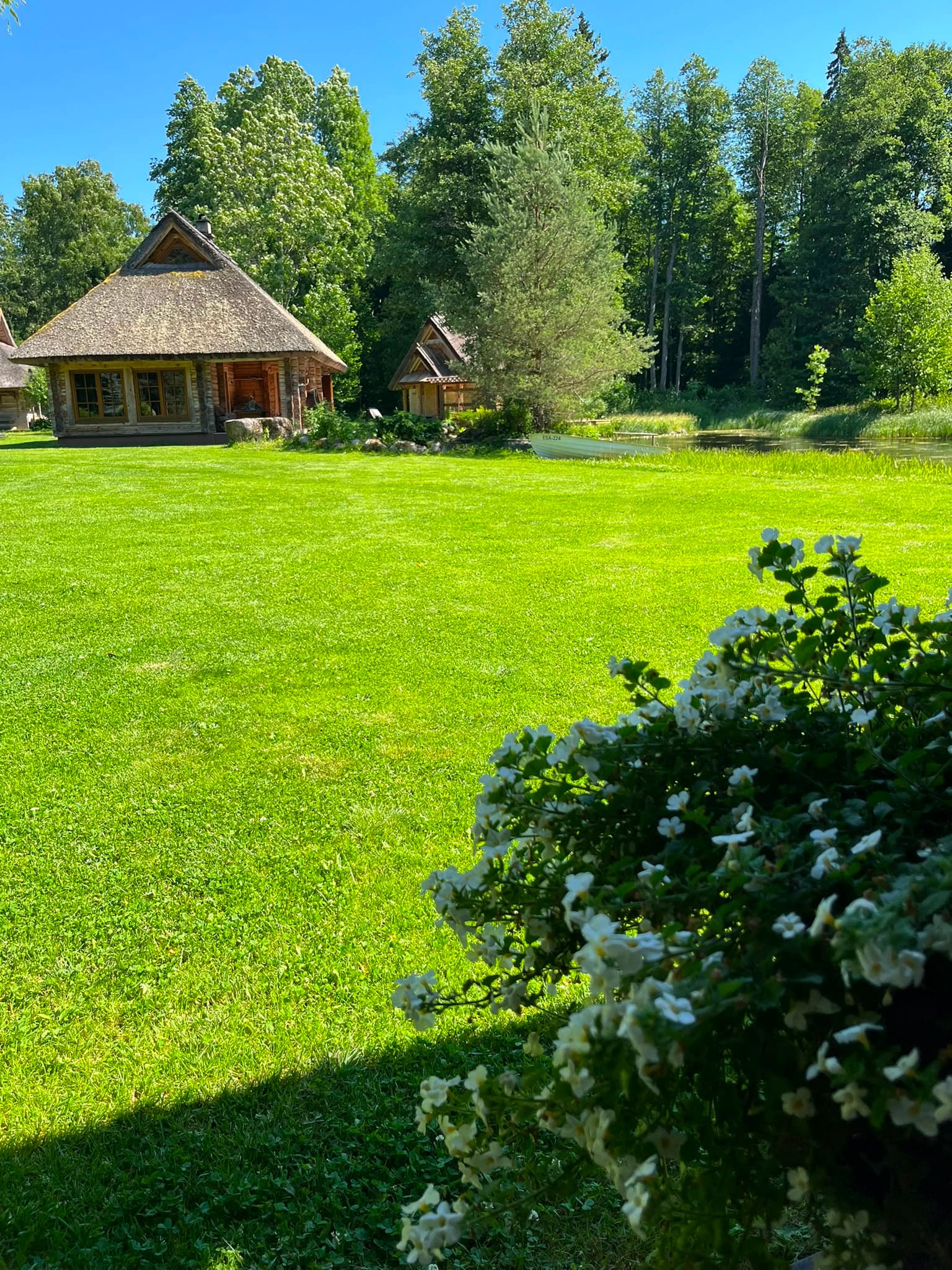 The sauna and the Pond House at the water